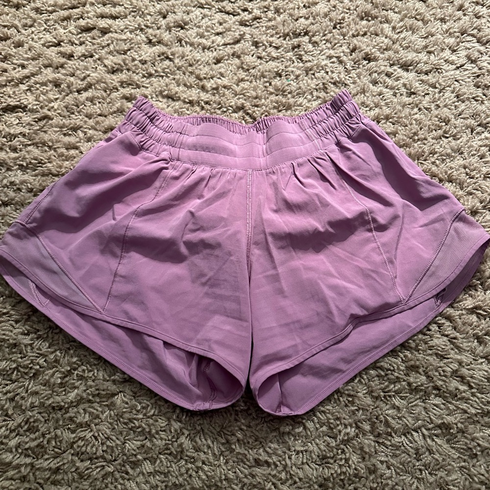 Lululemon hotty hot shorts 4” size 4 in a blush pink/ purple color.